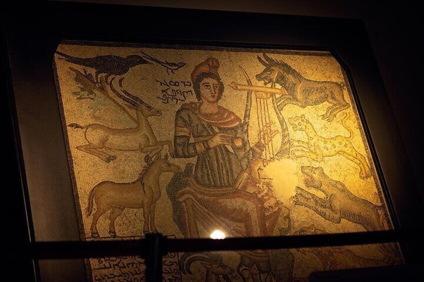 A mosaic with a central figure playing a lyre, surrounded by animals and mythological creatures. 2