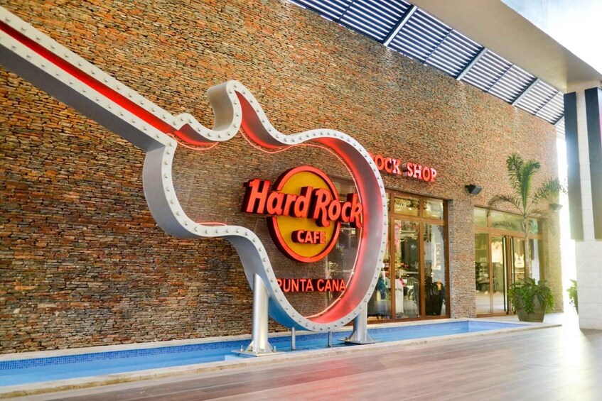 A Hard Rock Cafe with a distinctive guitar-shaped sign. 4