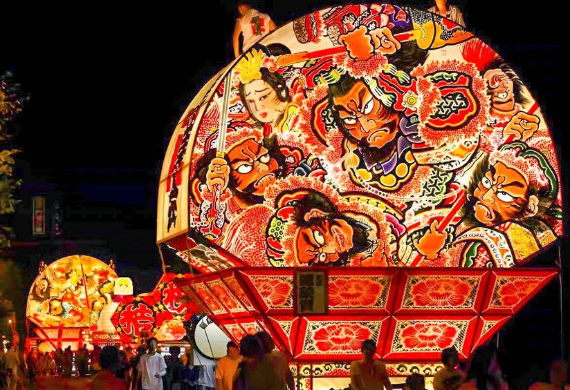 A large illuminated lantern with traditional Chinese designs and characters. 1