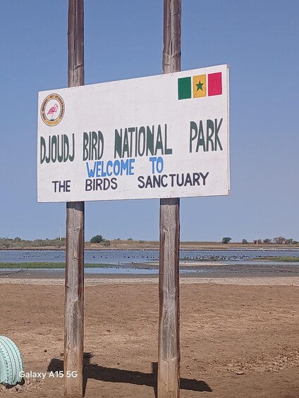 A sign for Djoudj Bird National Park welcoming visitors to the sanctuary. 2