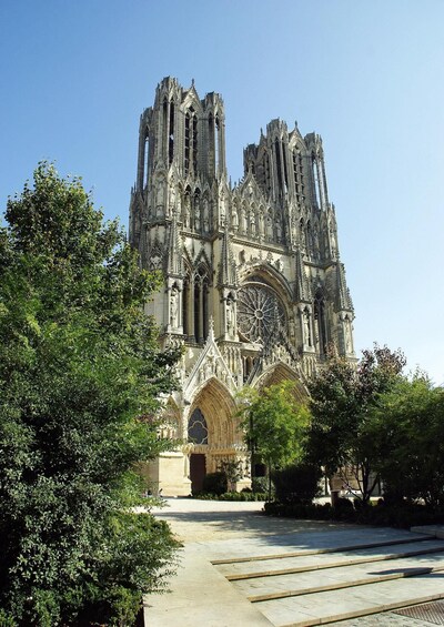 A Gothic cathedral with intricate stonework and a large rose window. 2