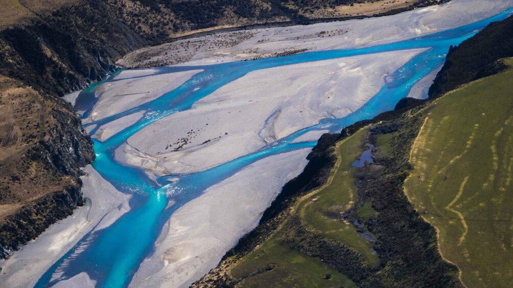 A glacier with turquoise meltwater streams. 5