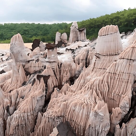A landscape of unique rock formations with sharp peaks and ridges. 2