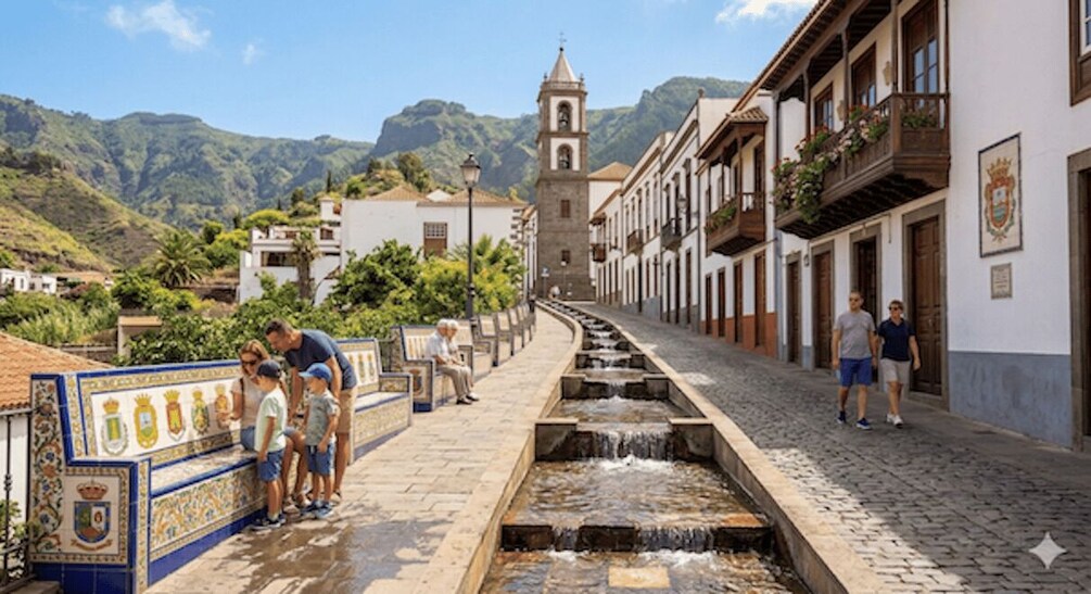 A cobblestone street with a water feature, buildings with balconies, and a tower in the background. 3