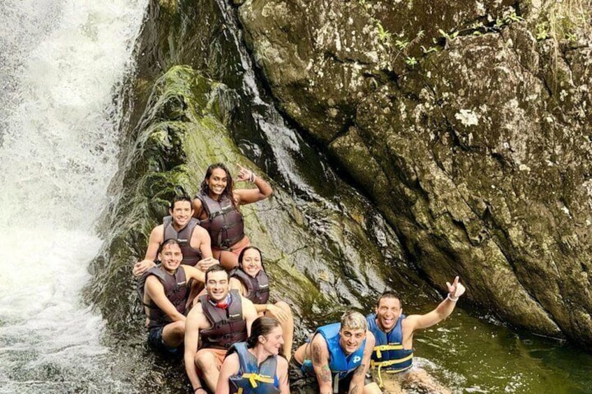 A group of people on a rocky waterfall. 3