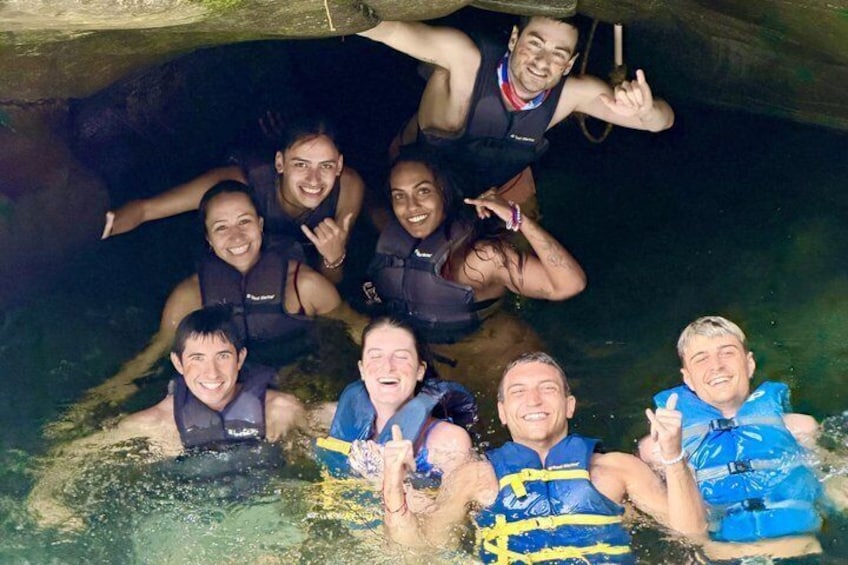 A group of people in a swimming pool with life jackets. 4
