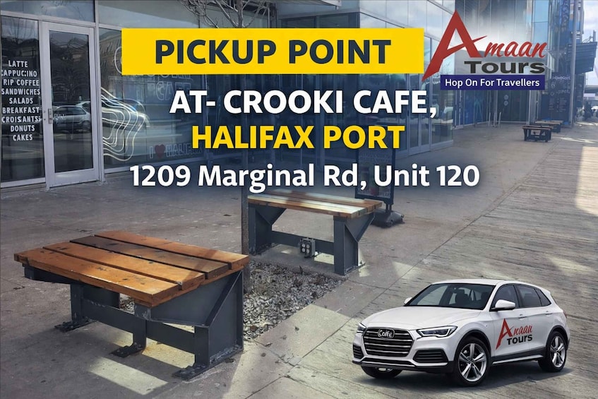 En upphämtningsplats vid Crooki Cafe i hamnen i Halifax, med en vit Audi och en träbänk. 2