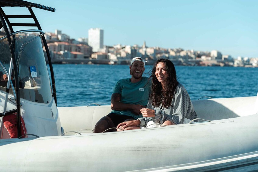 A couple on a boat with a cityscape in the background. 4