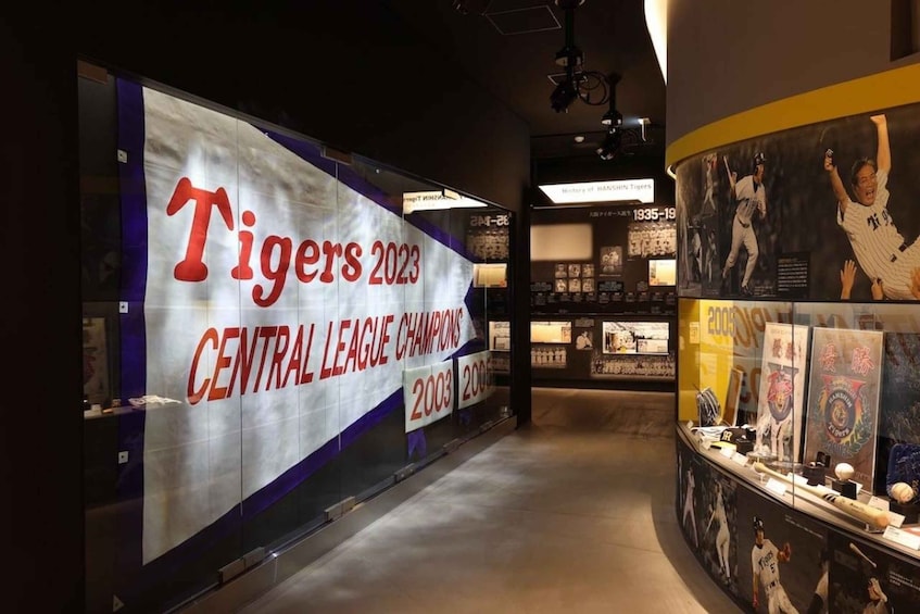 A sports museum with a large banner for the Tigers 2023 Central League Champions. 1