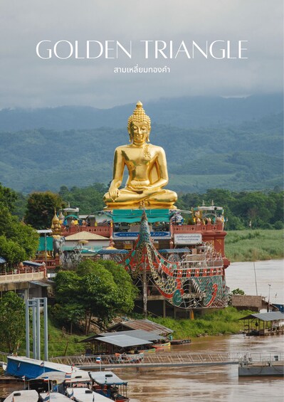 A large golden Buddha statue, a temple, and a river. 2