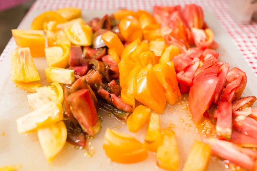 Chopped yellow and red bell peppers on a cutting board. 2
