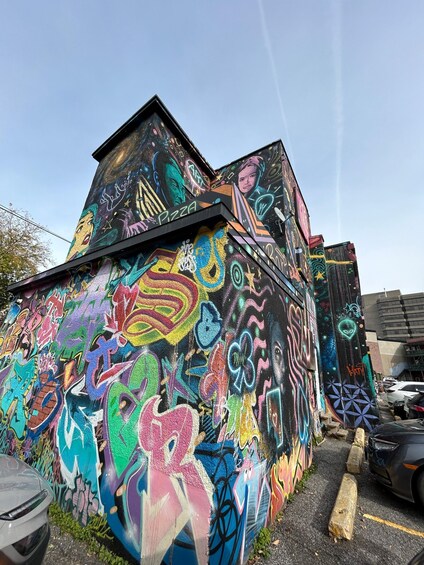 A building covered in colorful graffiti art. 2