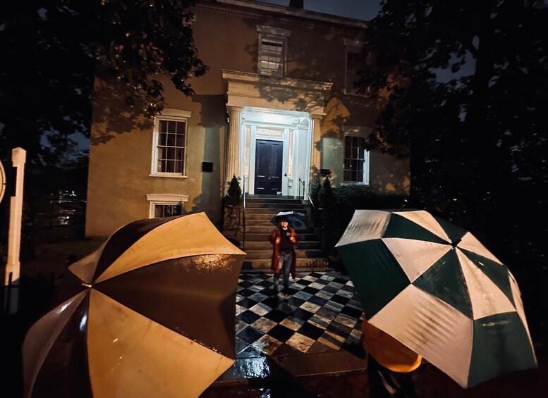 A house with a checkered floor and two umbrellas in front. 4