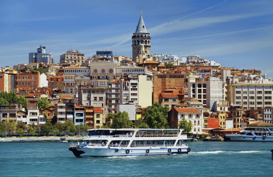 A cityscape with a prominent tower and a ferry in the foreground. 4