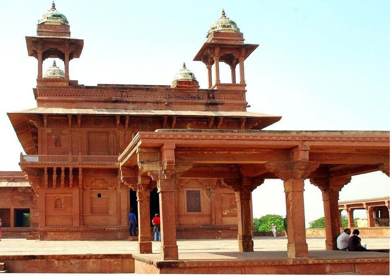 A large, ornate building with domed towers and intricate carvings. 5