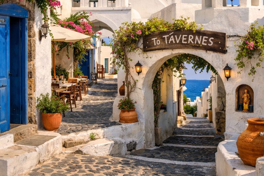 A cobblestone street leading to a tavern, with white buildings, blue doors, and potted plants. 3