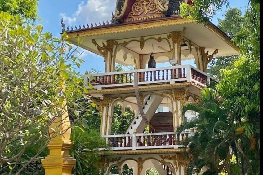 A multi-tiered, ornate pavilion with balconies and a staircase. 2