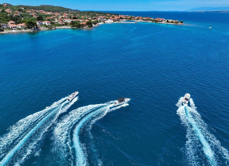A coastal town with houses and a clear blue sea. 3