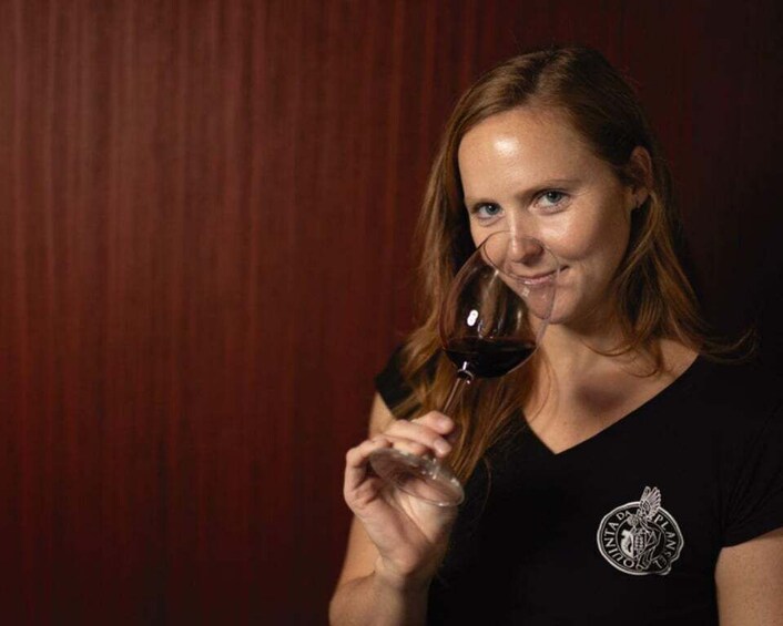 A person holding a wine glass. 5