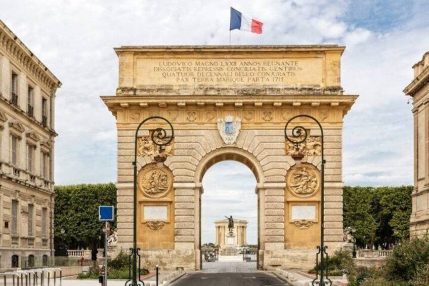 The Arc de Triomphe in Paris, with the French flag flying above. 5