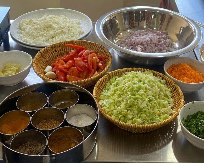 Various ingredients and spices laid out on a table. 3