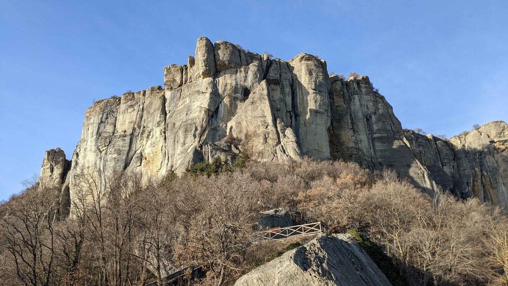 A rugged mountain with a wooden viewing platform. 2