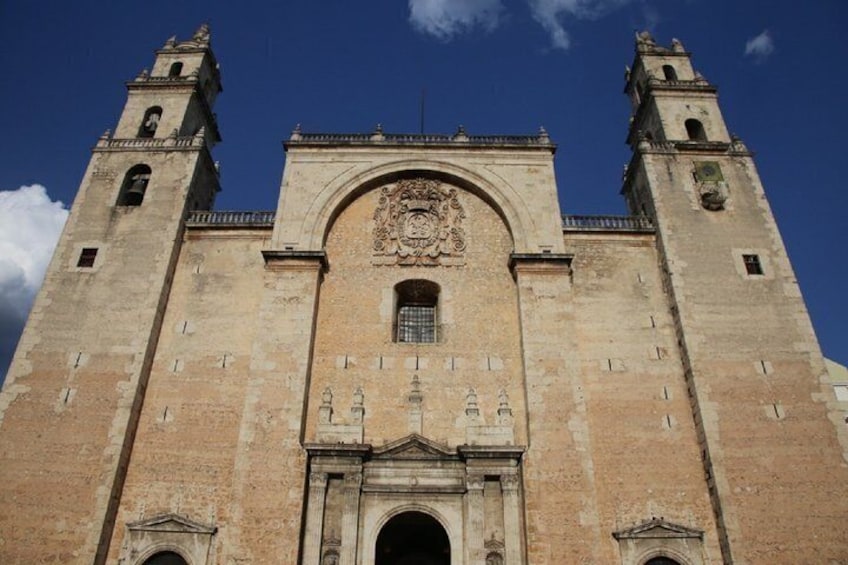 A historic church with two towers and a central archway. 2