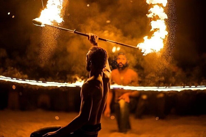 A person performing with fire. 3