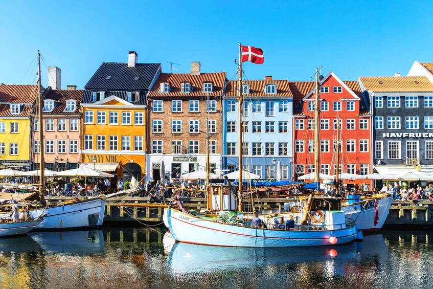 A harbor with colorful buildings and boats. 2