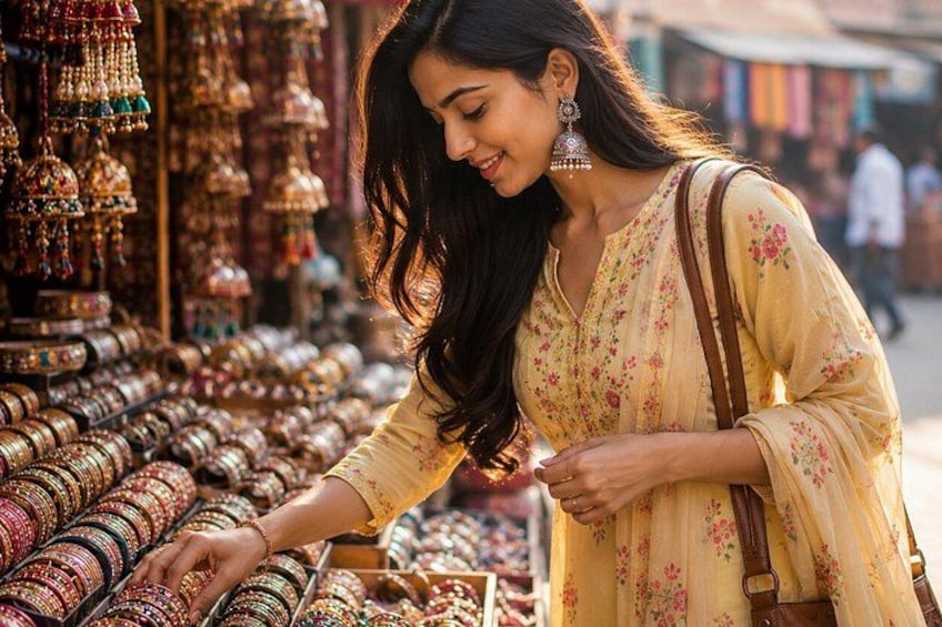 A person browsing through a jewelry stall with various bangles on display. 1