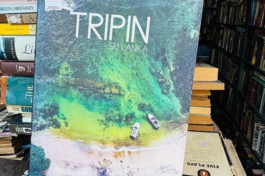 A book titled 'TRIPIN SRI LANKA' with a beach scene on the cover. 2