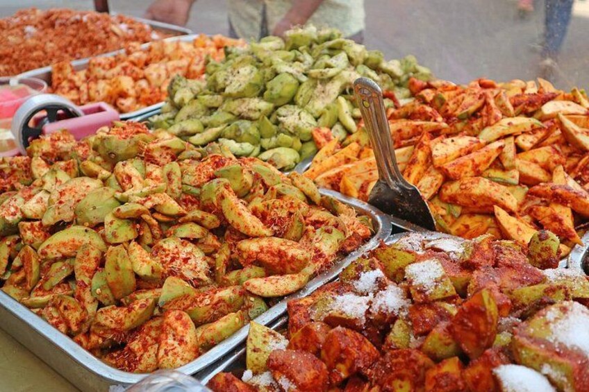 A variety of fried snacks, including seasoned potatoes and other vegetables, displayed in trays. 5