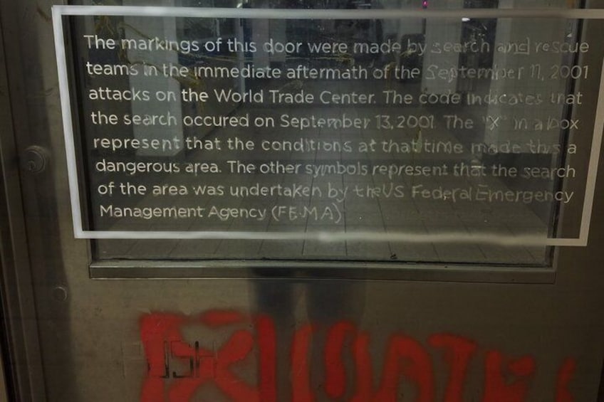 A door with a warning sign and graffiti. 3
