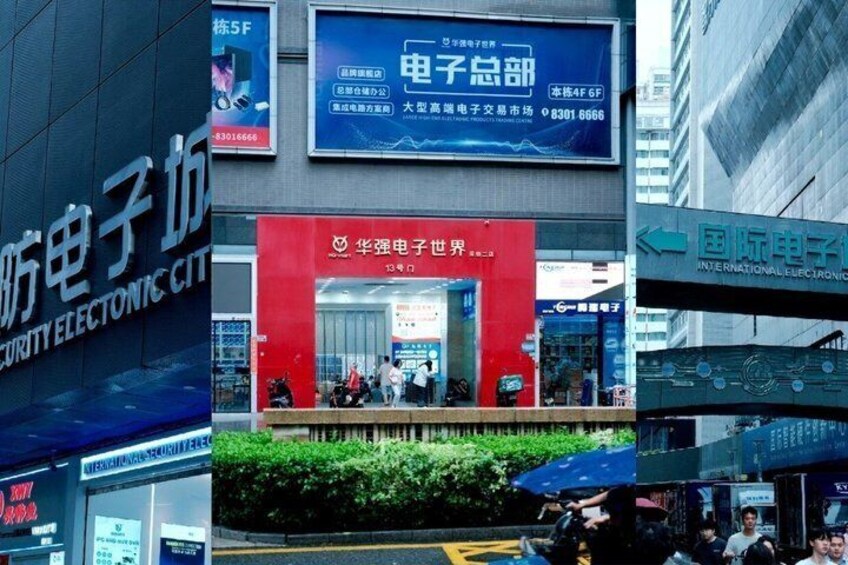 A busy urban street with electronic stores and a prominent red entrance to a building. 5