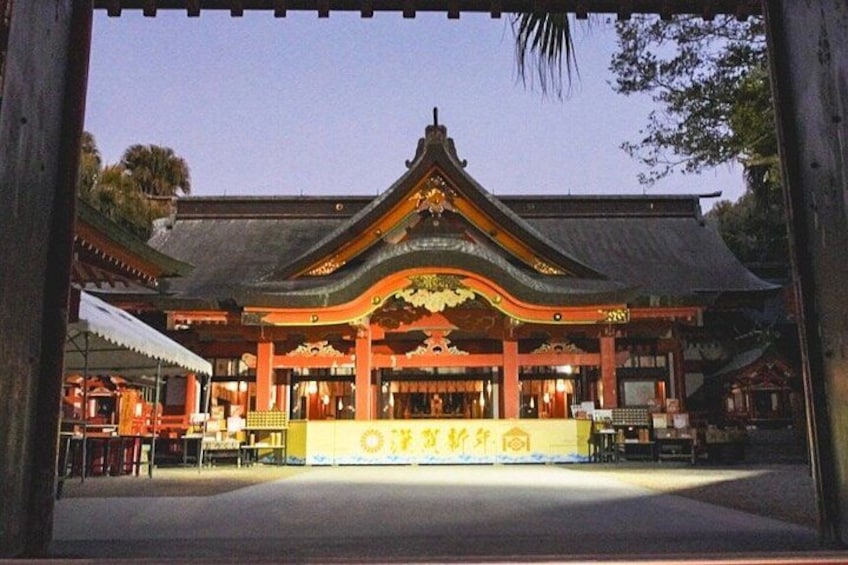 A traditional Japanese building with a curved roof and a central shrine. 1