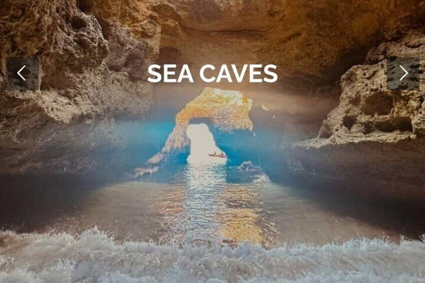 A cave with a sea cave entrance, water, and rocky walls. 4