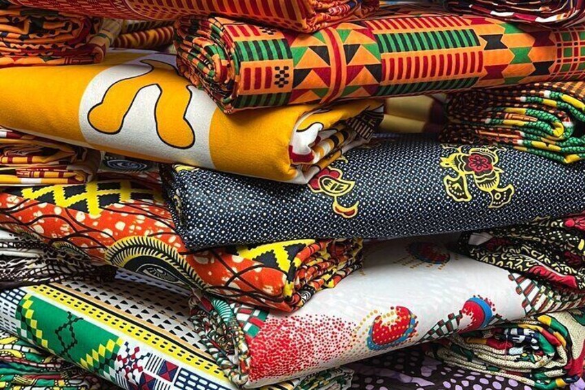 A variety of colorful fabrics with intricate patterns and designs. 3