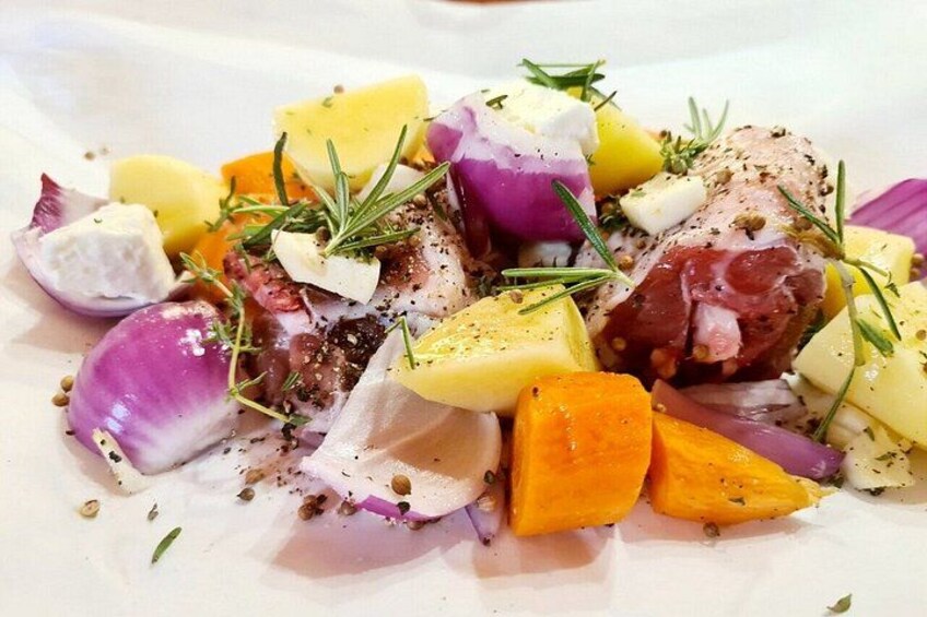 A dish with various vegetables and herbs. 5