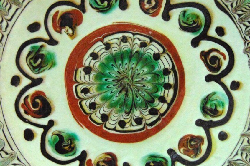A detailed mandala pattern with concentric circles and floral motifs. 5