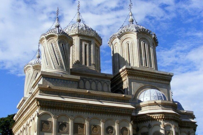 A historic building with ornate domes and detailed architectural design. 2