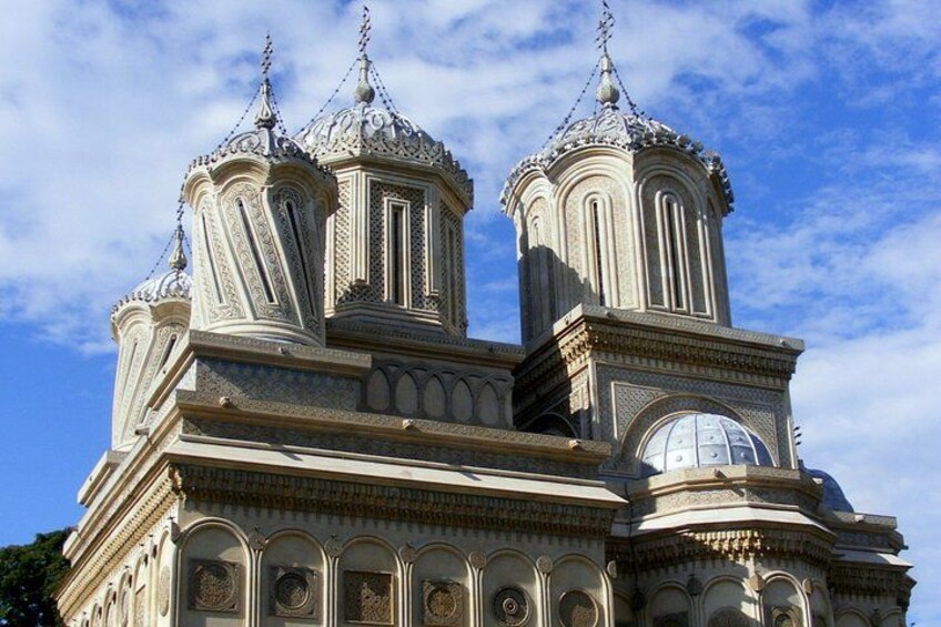 A historic building with ornate domes and detailed architectural design. 2