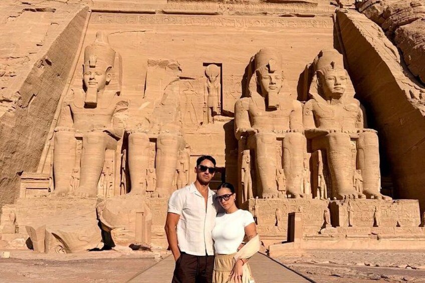 A large ancient Egyptian temple with colossal statues of pharaohs. 3