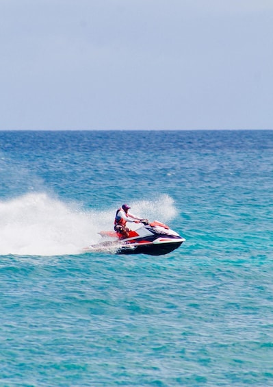 A person jet-skiing on a body of water. 3