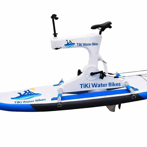 A white and blue water bike with a seat and handlebars, labeled 'Tiki Water Bikes.' 5