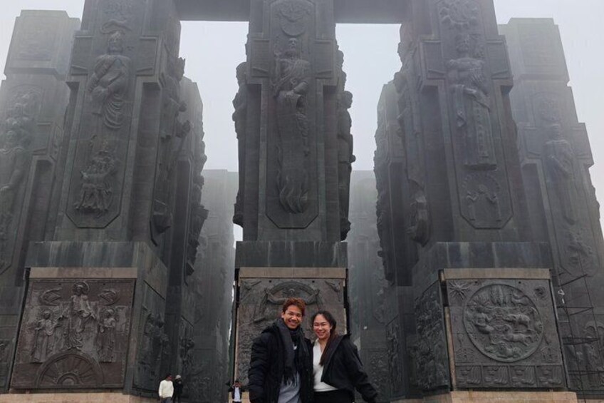 A historical monument with intricate carvings and a central archway. 4