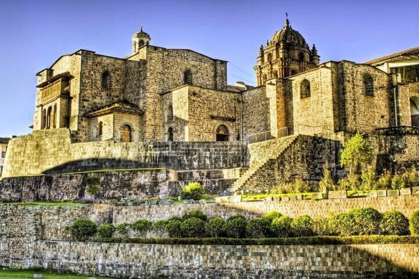 A historic stone building with a dome and a bell tower. 2