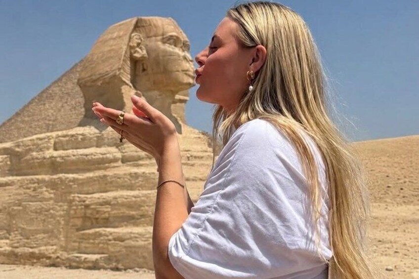 A person in front of the Great Pyramid of Giza. 1