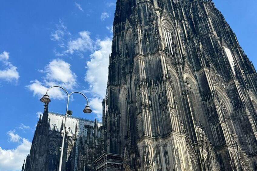 A Gothic cathedral with intricate stonework and a clear blue sky. 2
