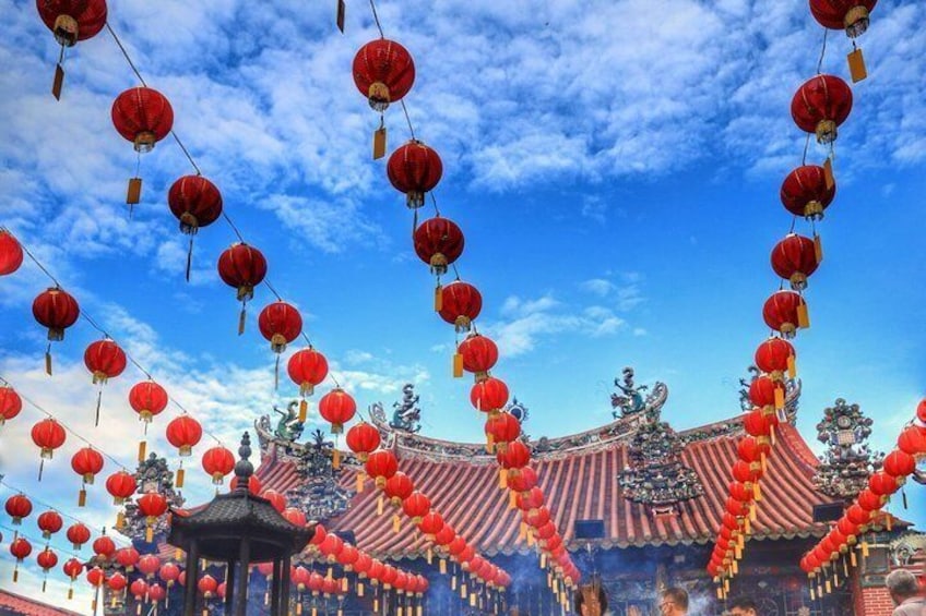 A traditional Chinese temple with red lanterns and ornate architecture. 3