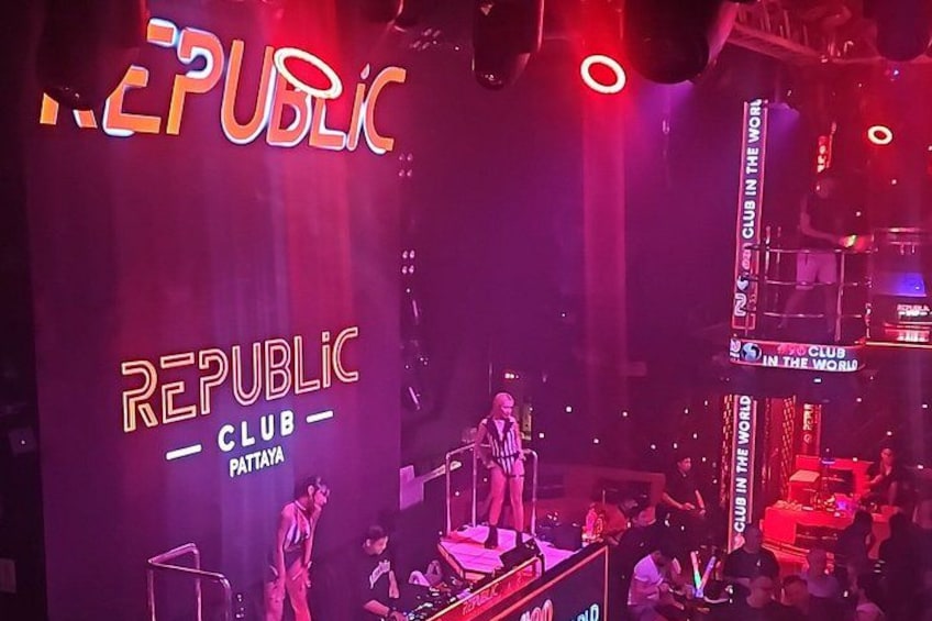 A stage with a large screen displaying 'REPUBLIC CLUB' and 'PATAYA'. 1